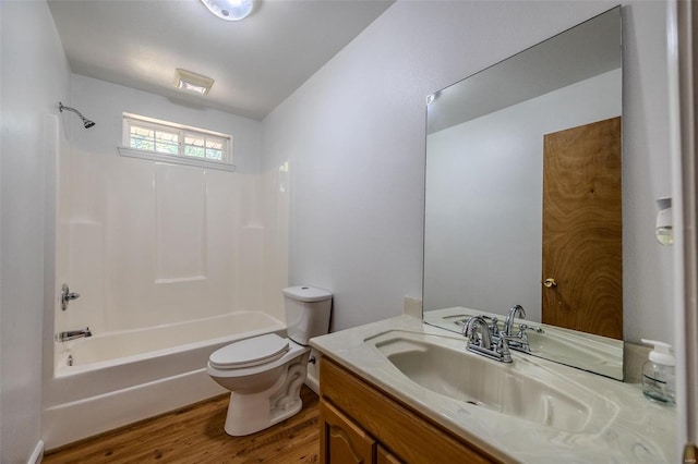 full bathroom with vanity, toilet, bathtub / shower combination, and hardwood / wood-style floors