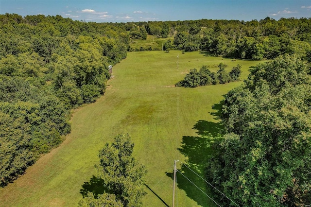 birds eye view of property with a rural view