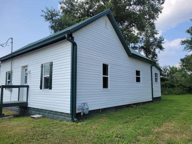 view of home's exterior featuring a lawn