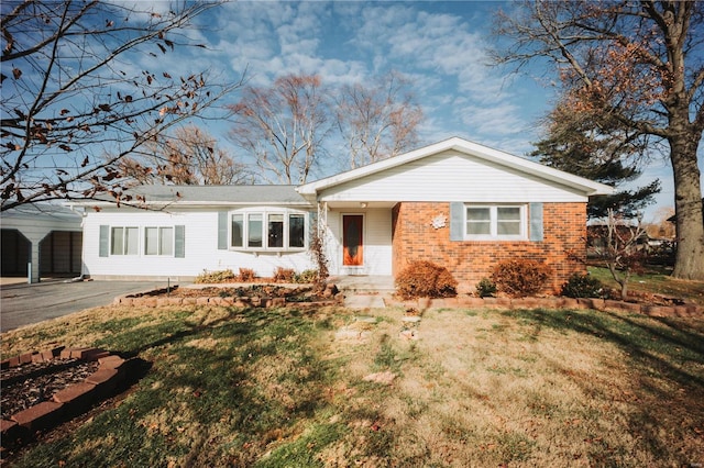 ranch-style house with a front lawn