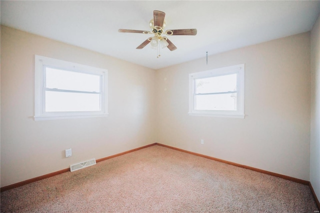 carpeted empty room with ceiling fan