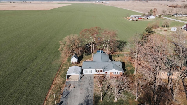 birds eye view of property with a rural view