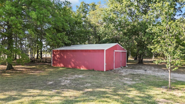 view of outbuilding with a lawn