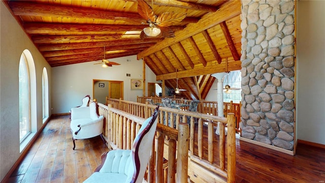 living area featuring vaulted ceiling with beams, wood ceiling, hardwood / wood-style flooring, and ceiling fan