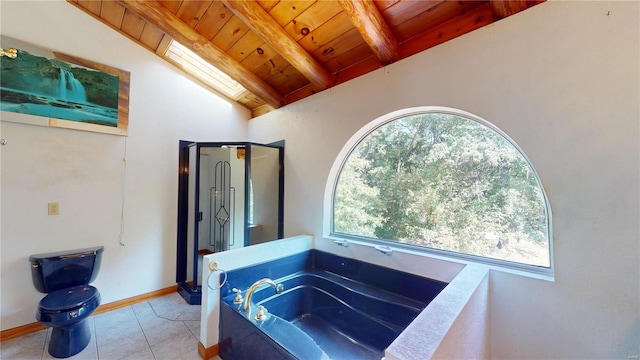 bathroom with lofted ceiling with skylight, wooden ceiling, a bath, and a wealth of natural light