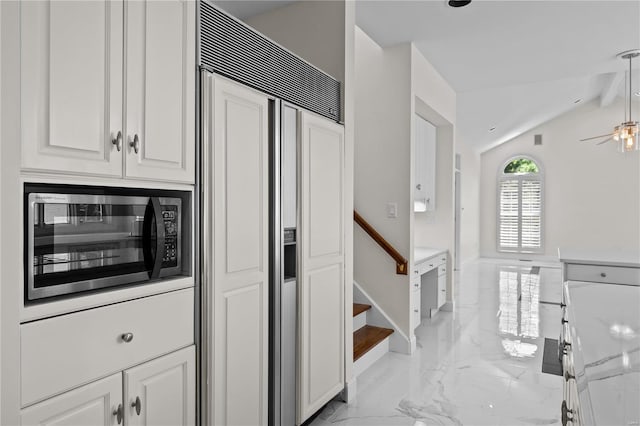 kitchen featuring white cabinetry, vaulted ceiling with beams, light tile patterned floors, ceiling fan, and built in appliances