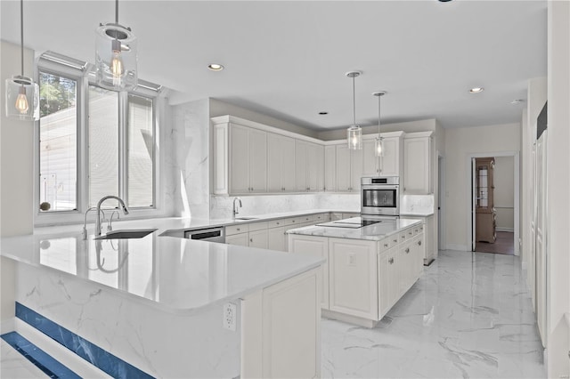 kitchen featuring a center island, pendant lighting, white cabinets, and light tile patterned floors