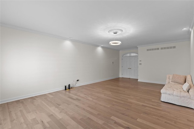 interior space featuring light hardwood / wood-style flooring and crown molding