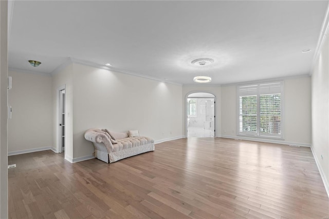 interior space featuring light hardwood / wood-style floors and ornamental molding