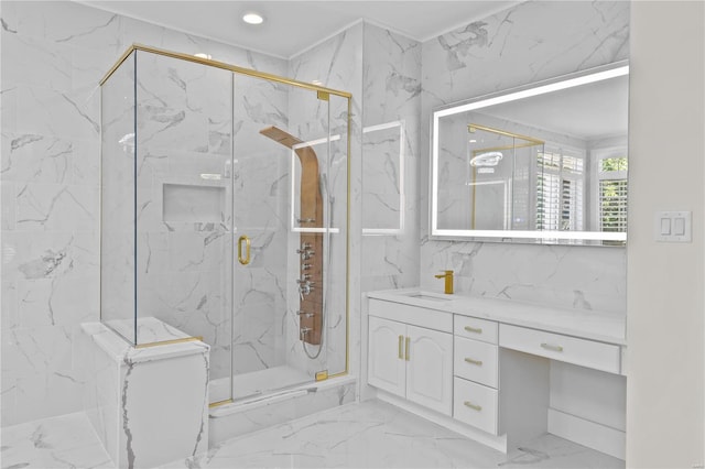 bathroom featuring tile patterned floors, an enclosed shower, vanity, and tile walls