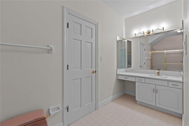 bathroom with tile patterned floors, a shower with door, and vanity