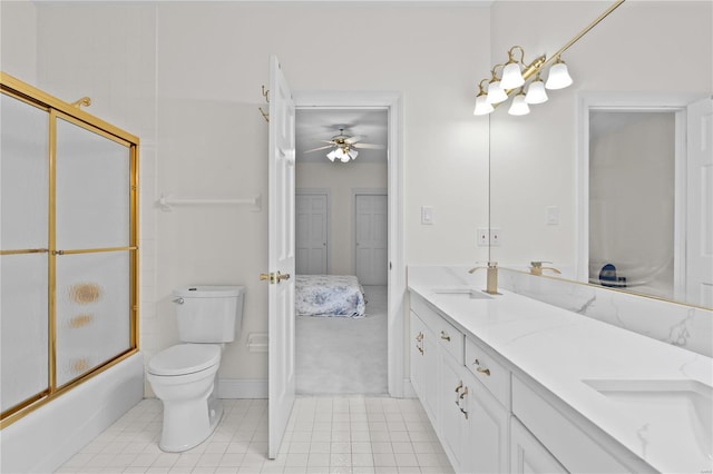 full bathroom featuring tile patterned flooring, vanity, ceiling fan, bath / shower combo with glass door, and toilet