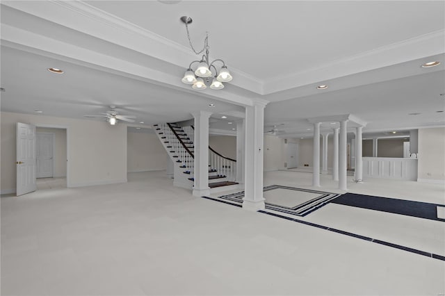 interior space with crown molding, ceiling fan with notable chandelier, and decorative columns