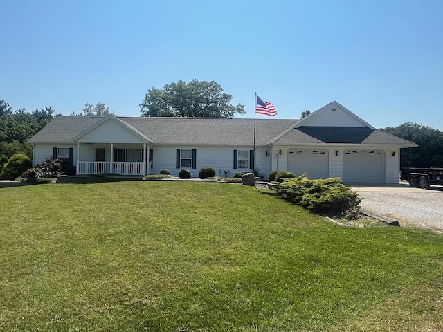 single story home featuring a garage, a front yard, covered porch, and gravel driveway