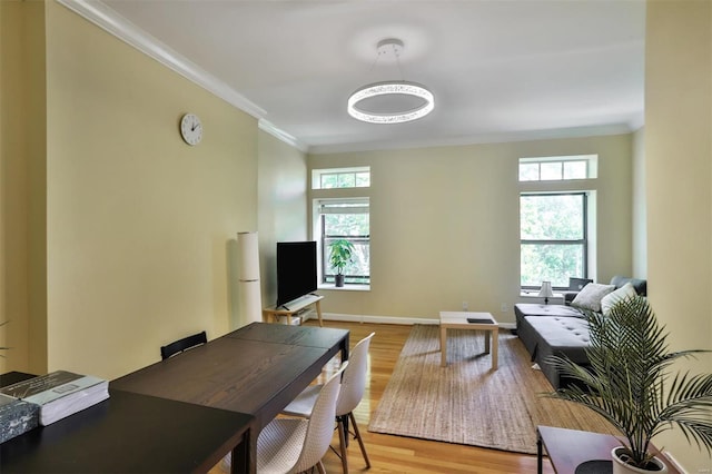 office with crown molding and light wood-type flooring