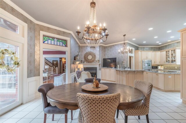 tiled dining room with crown molding and an inviting chandelier