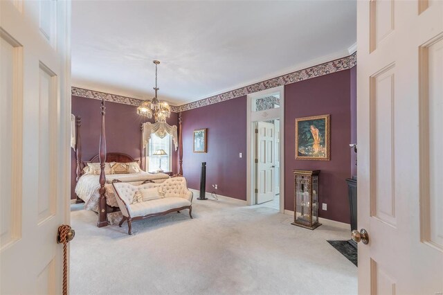 carpeted bedroom featuring an inviting chandelier and crown molding