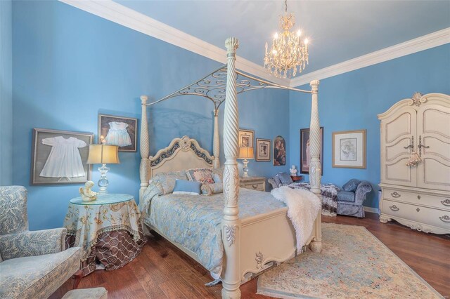 bedroom with hardwood / wood-style flooring, an inviting chandelier, and ornamental molding