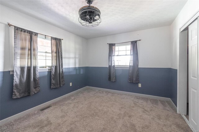 empty room with carpet flooring