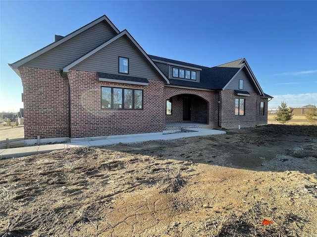 traditional-style home with brick siding