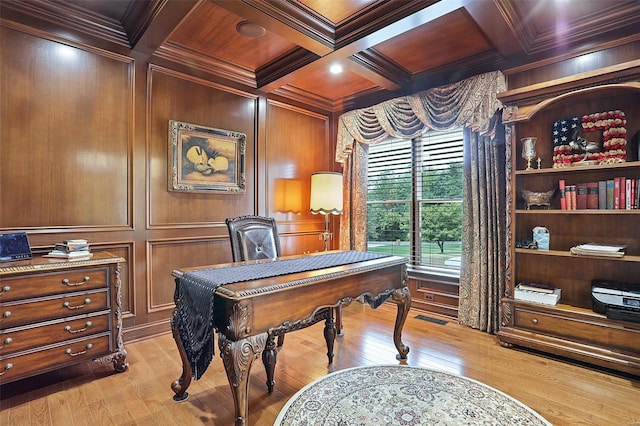 office space featuring beam ceiling, coffered ceiling, light wood-type flooring, wood ceiling, and ornamental molding