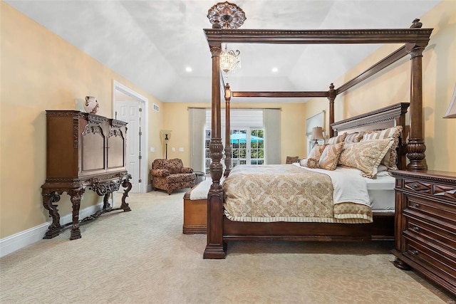 carpeted bedroom featuring lofted ceiling and access to exterior