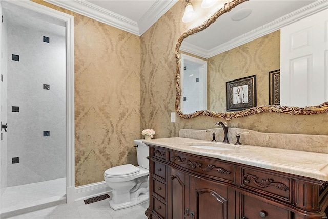 bathroom with toilet, ornamental molding, tile patterned flooring, and vanity