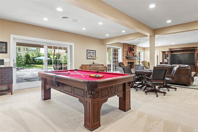 playroom featuring light colored carpet, a fireplace, beam ceiling, french doors, and pool table