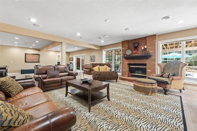 living room with light carpet and a fireplace