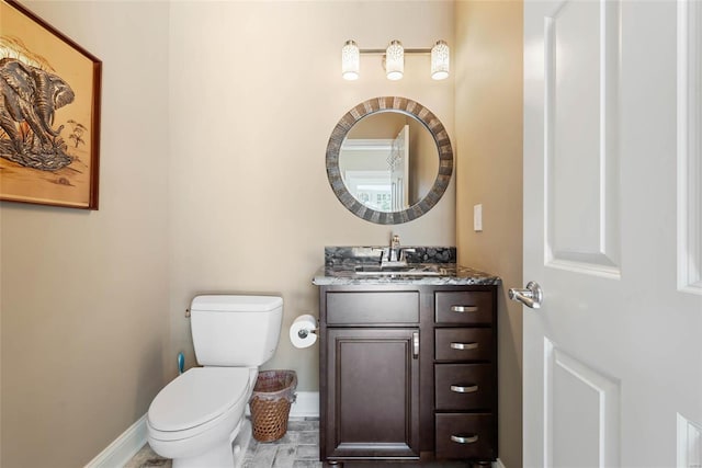 bathroom with toilet and vanity