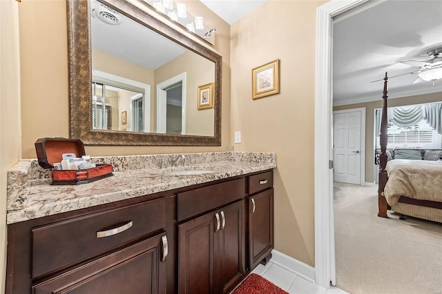 bathroom featuring ceiling fan, vanity, and crown molding