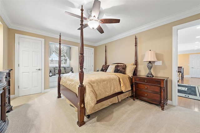 bedroom featuring ceiling fan, light colored carpet, and crown molding