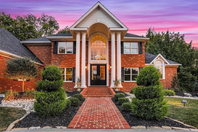 greek revival inspired property featuring french doors