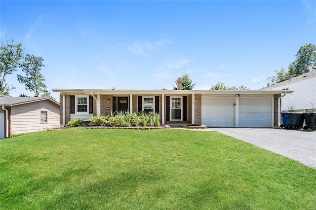 single story home with a front yard and a garage