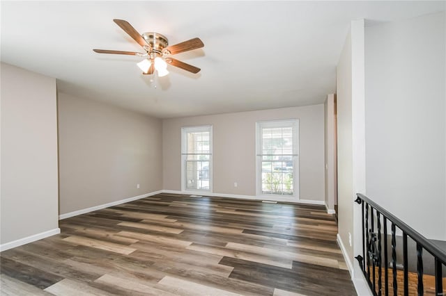 spare room with ceiling fan and wood-type flooring