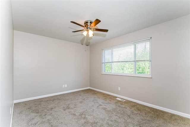 unfurnished room with carpet flooring and ceiling fan