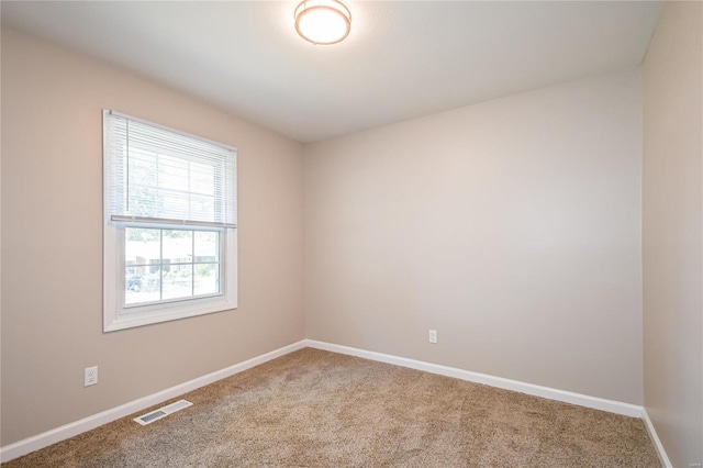 unfurnished room featuring carpet floors