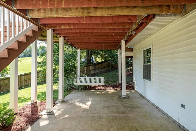 view of patio / terrace featuring fence