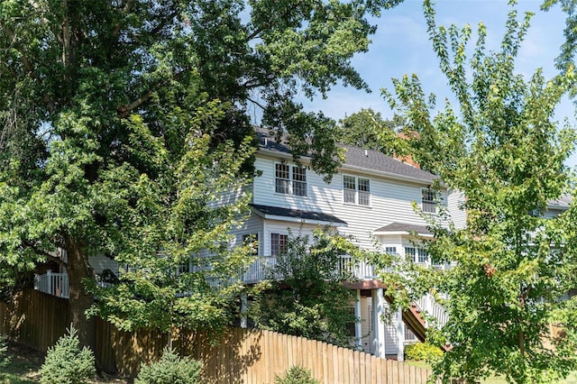 rear view of house with fence