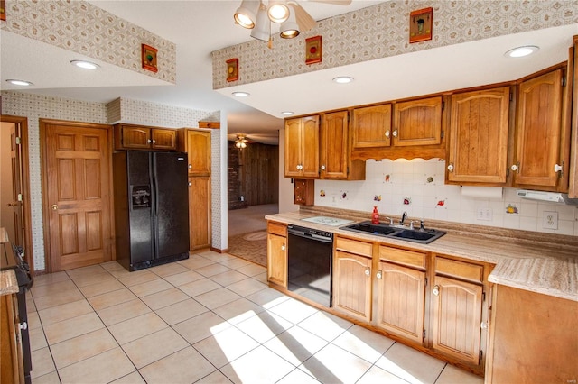 kitchen featuring light carpet, tasteful backsplash, black appliances, sink, and ceiling fan