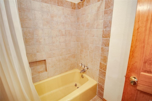 bathroom featuring shower / bath combo with shower curtain