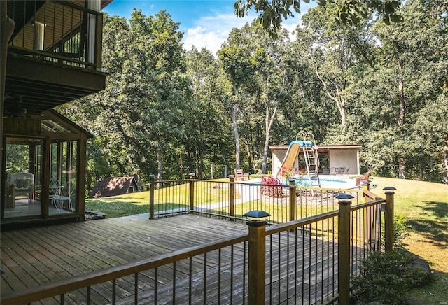 deck with a yard and a sunroom