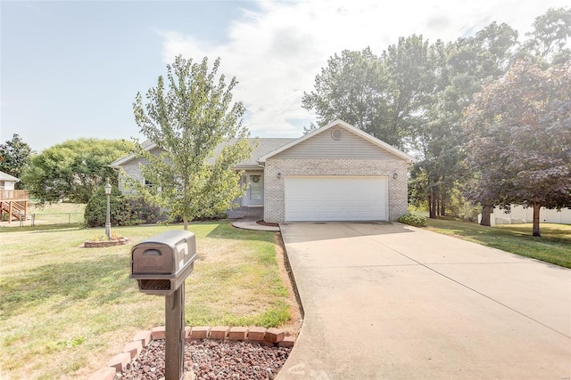 view of front of house with a garage and a front lawn