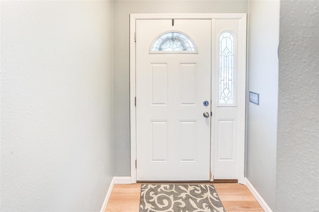 entryway with light hardwood / wood-style floors