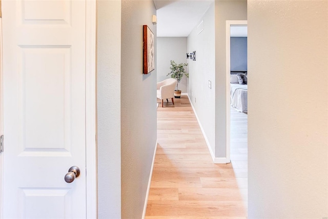 corridor featuring light hardwood / wood-style flooring