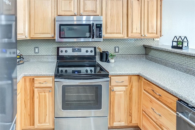 kitchen with tasteful backsplash, light brown cabinetry, and stainless steel appliances