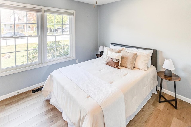 bedroom with light hardwood / wood-style flooring