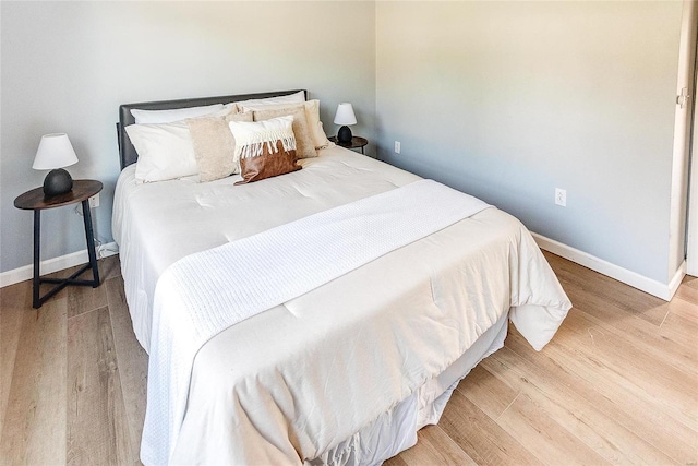 bedroom with light hardwood / wood-style flooring