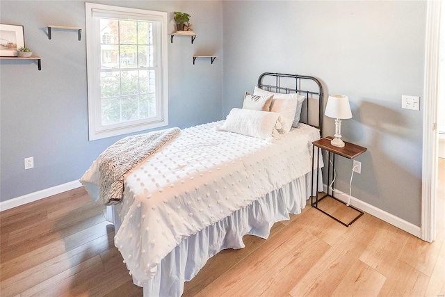 bedroom featuring light hardwood / wood-style floors