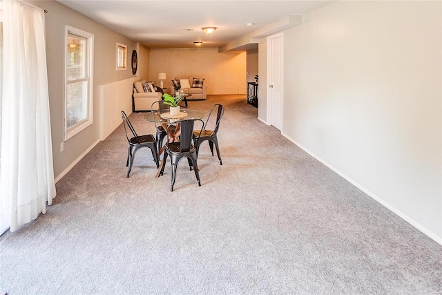 view of carpeted dining area